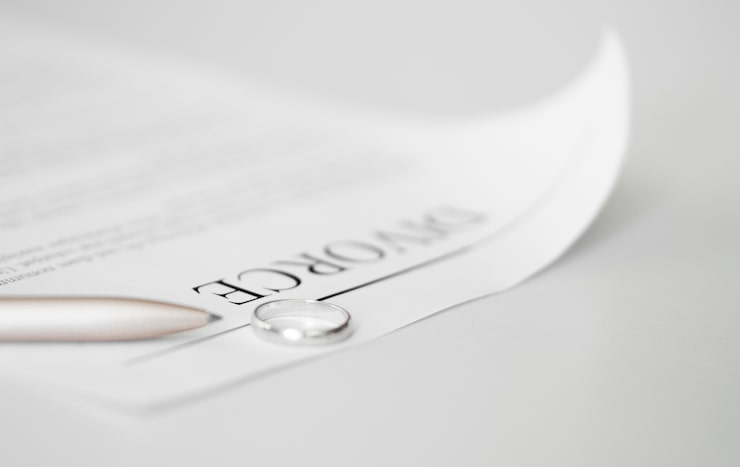 Close up of a signature on a heavy paper contract