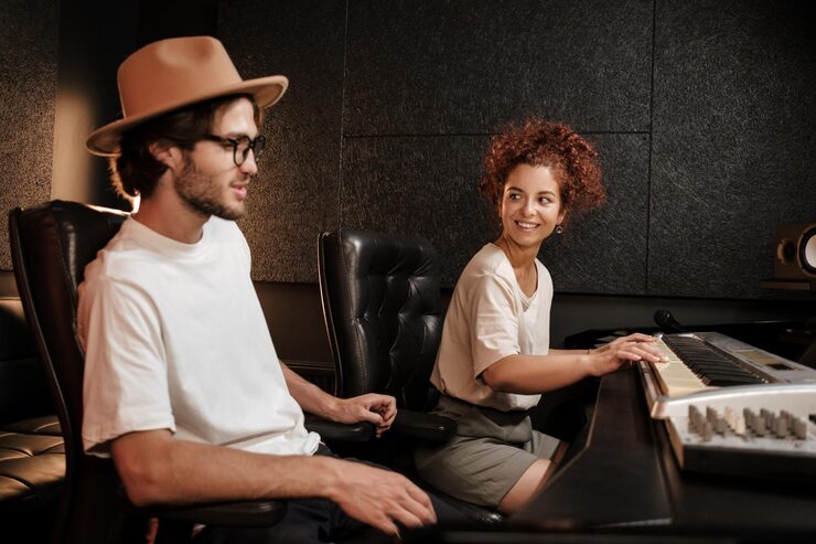 Artist and producer talking