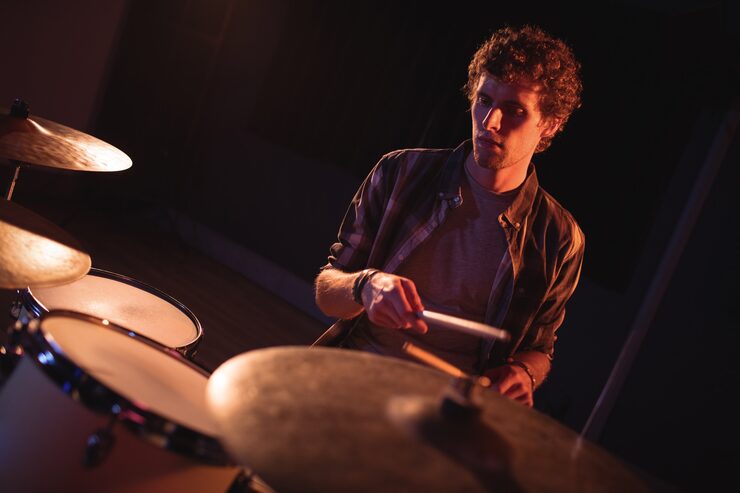Drummer playing in massive live room