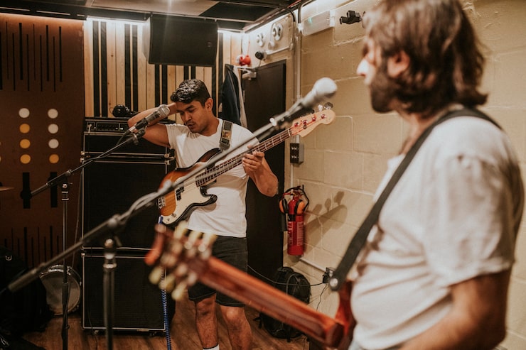 Band arguing over arrangements in a rehearsal room