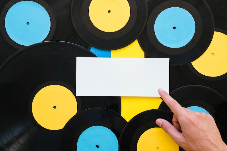 Vinyl record being pressed between stampers